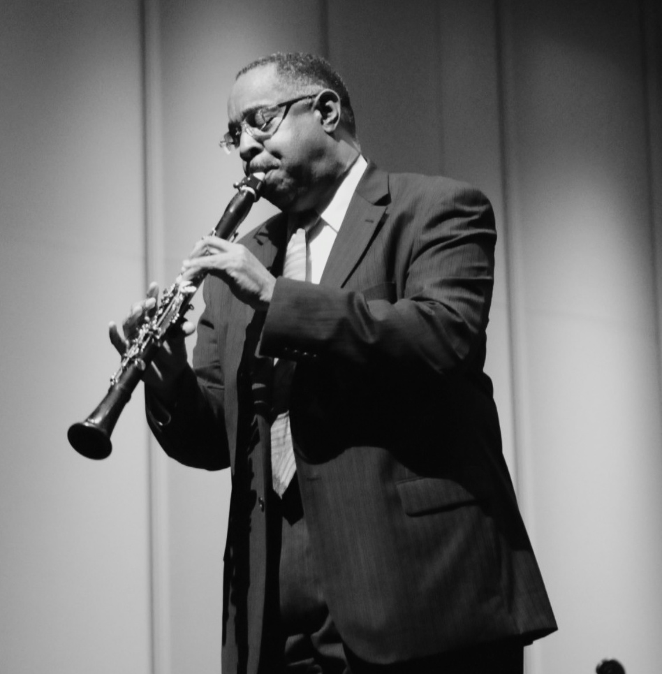 Black and white portrait of Dr. Michael White playing the clarinet.